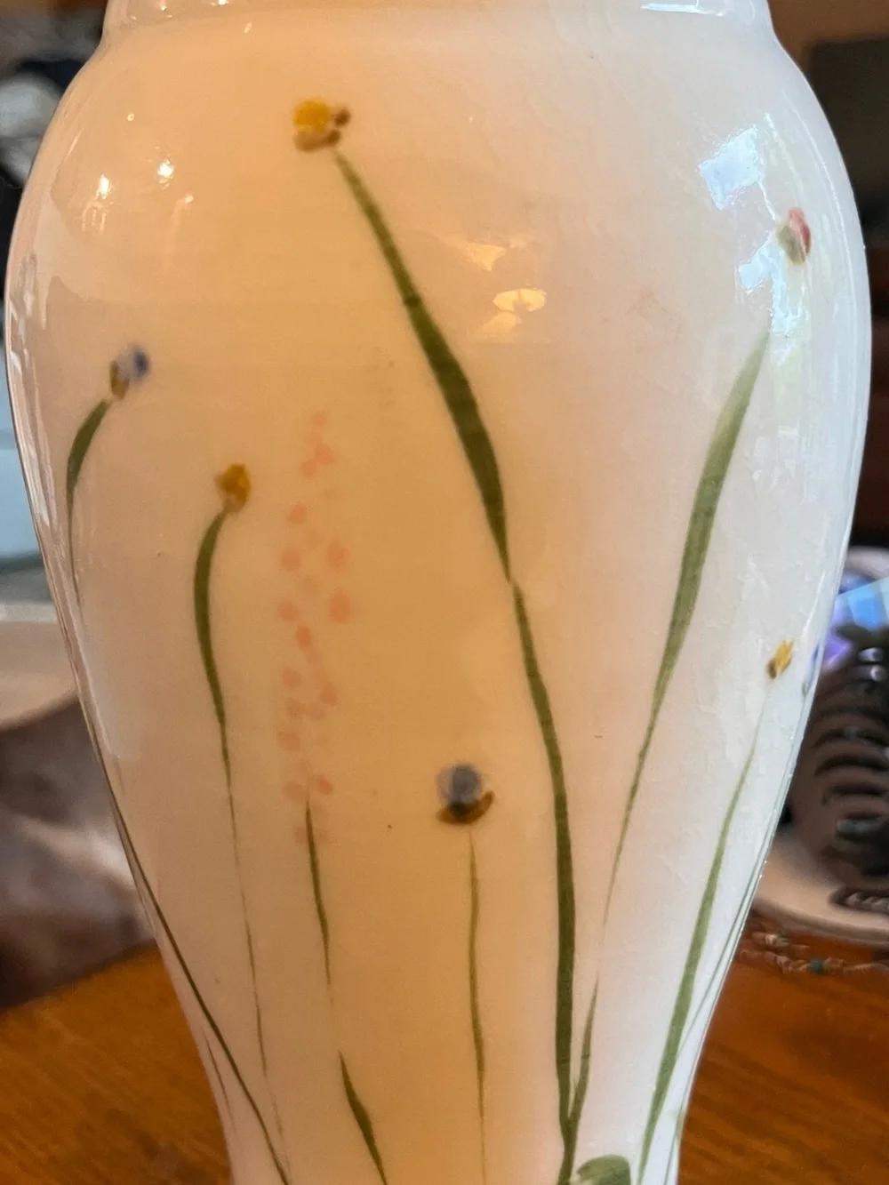 Sheepscott River Pottery tall fluted vase in Meadow design. Vase stands 10 1/2”.